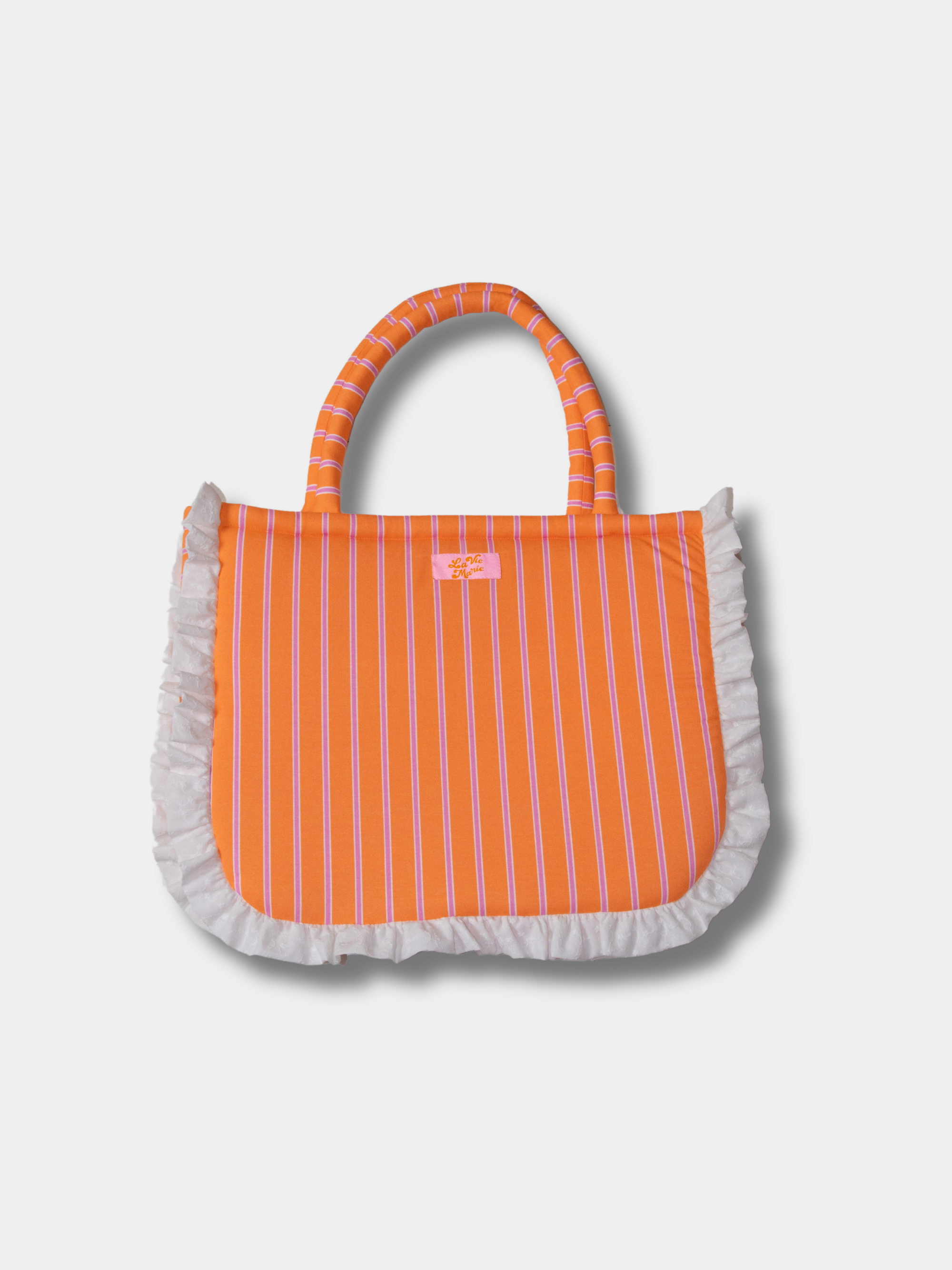Volant & blush bag